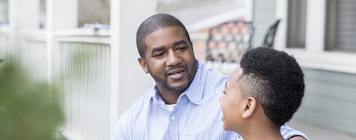 man talking to his son